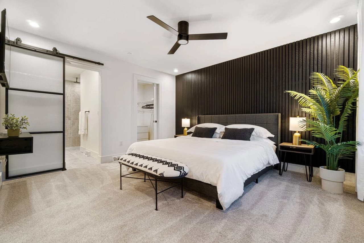 2 chairs on a deck on lake side